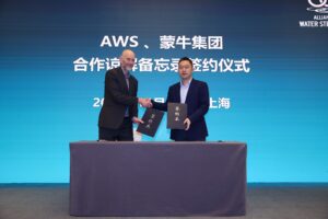 Mr. Adrian Sym and Mr. Di Lin signing a Memorandum of Understanding (MoU) between AWS and Mengniu Group