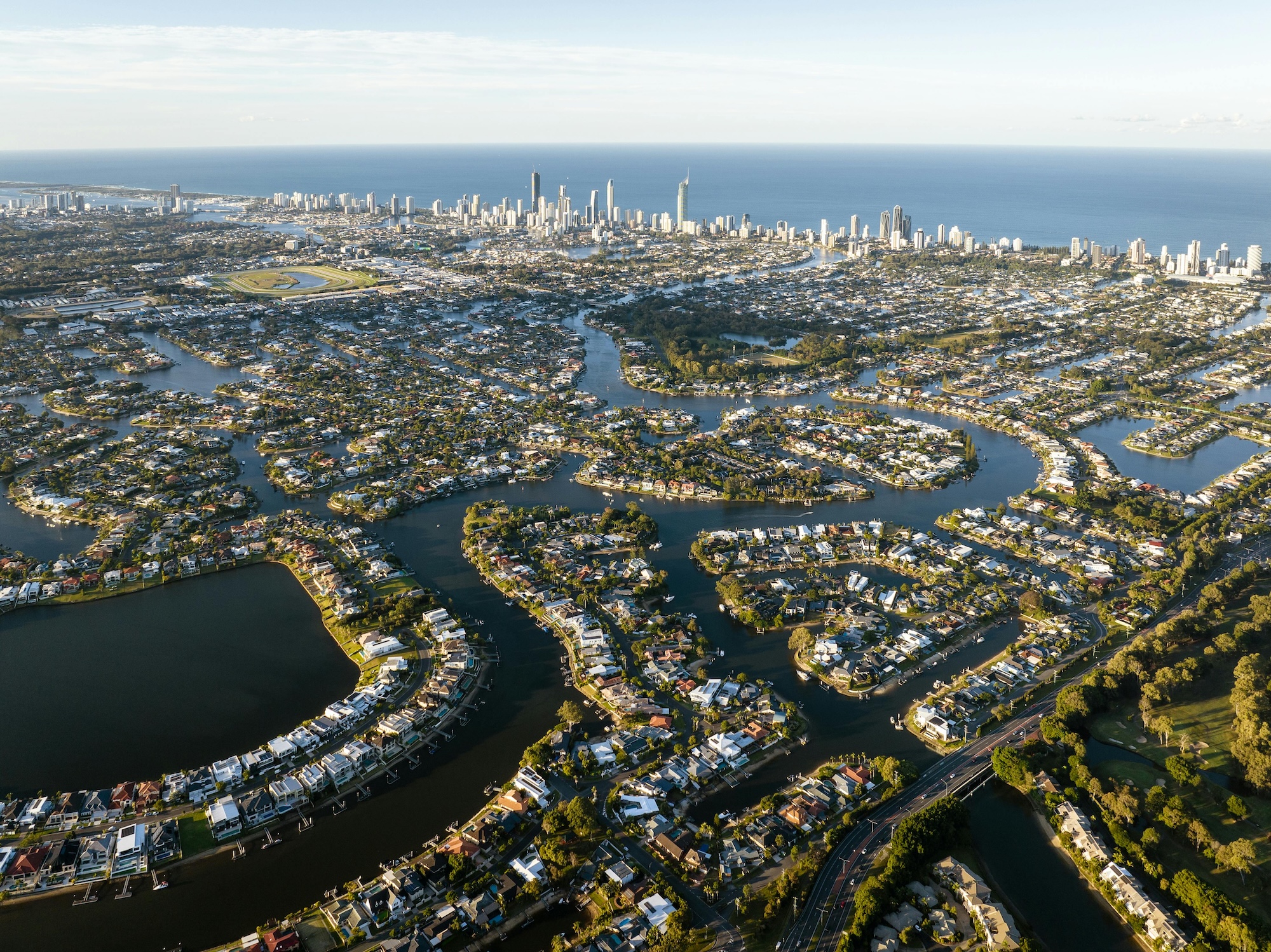 Scenic Photo of a City by a Lagoon. Clear Island Waters, QLD, Australia. Josh Withers/Pexels.