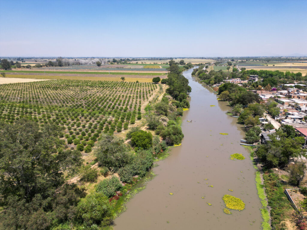 Drone shot of Lerma River in La Maltarana region showing farms and nearby houses