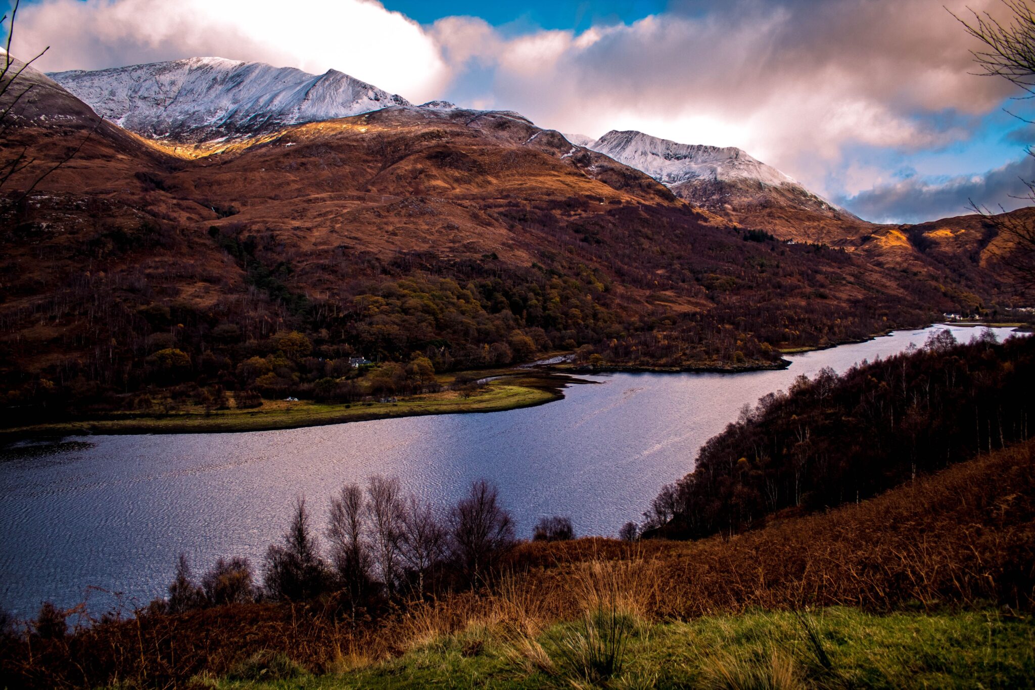 AWS AGM. Beautiful view of Highland, Scotland featuring snowcapped mountains and a tranquil lake. Pexels/Darrell Gough